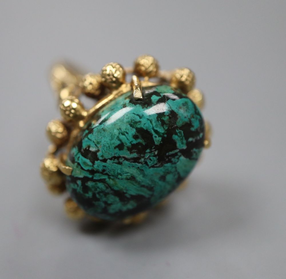 A continental yellow metal and malachite? set dress ring, size N, gross 8.7 grams.